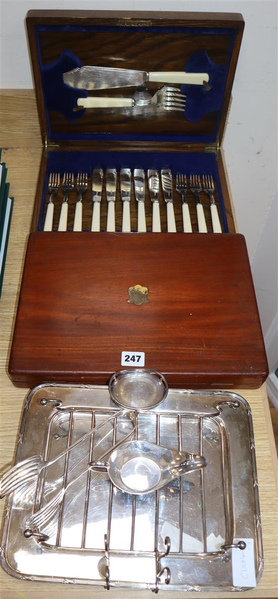 Two cased sets/part sets of cutlery and a plated asparagus dish.